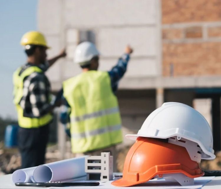 Engineers and a safety helmet on a construction site